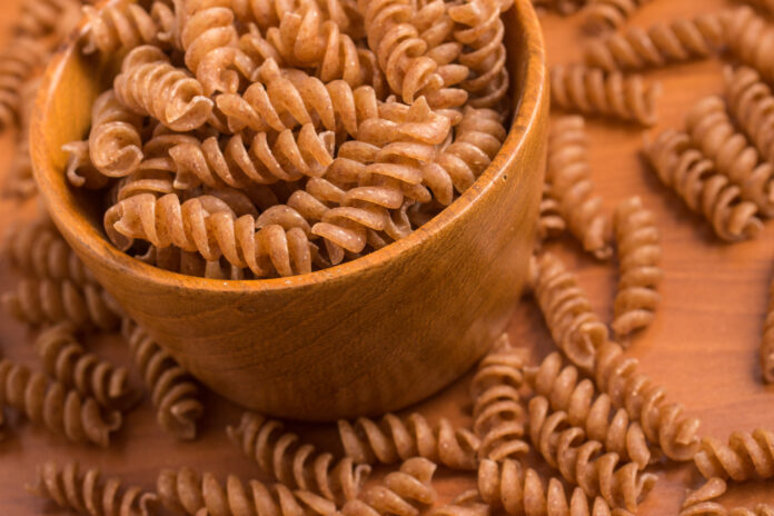 Wholemeal Fusilli into a bowl. Integral Pasta