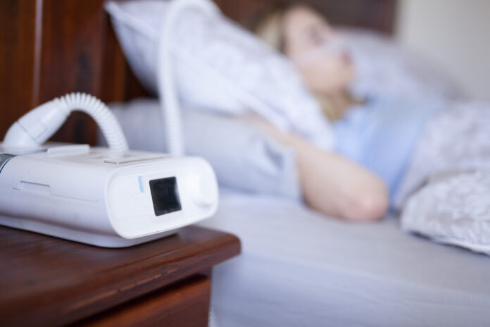 Cpap machine, Woman wearing oxygen mask with copy space