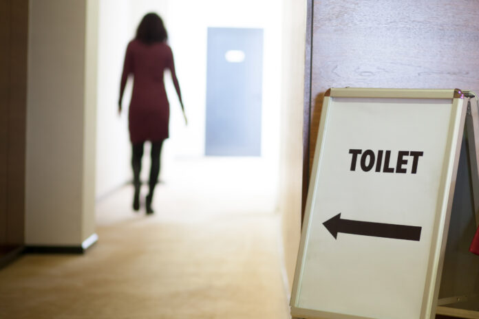 woman going to toilet Urinary incontinence